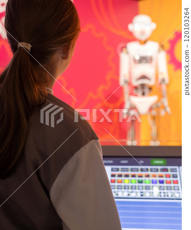 Children control a robot at a science fair using a tablet computer. Modern technologies and scientific education of children 120103264