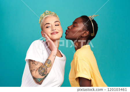 Its not a competition. We all deserve a crown. Studio shot of two young women wearing crowns and kissing against a turquoise background. Its not a competition. We all deserve a crown. Studio shot of two young women wearing crowns and kissing against a turquoise background. 120103461