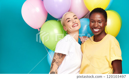 Celebrate the special women in your life. Studio shot of two young women holding a bunch of colourful balloons against a turquoise background. Celebrate the special women in your life. Studio shot of two young women holding a bunch of colourful balloons against a turquoise background. 120103497
