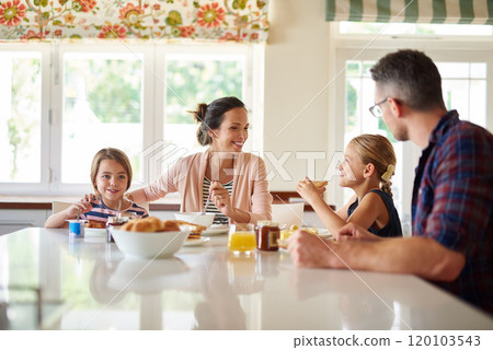 Having fun at the breakfast table. Shot of a family having breakfast together. 120103543