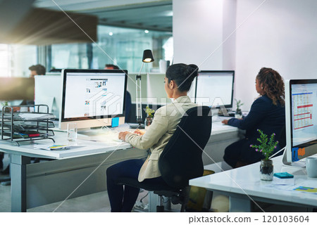 Success is the product of teamwork. Shot of corporate colleagues working together in their office. 120103604