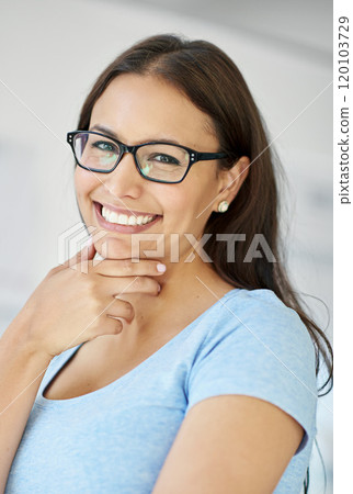 Lifes too short to have a boring job. Cropped shot of a smiling young businesswoman in her office. 120103729
