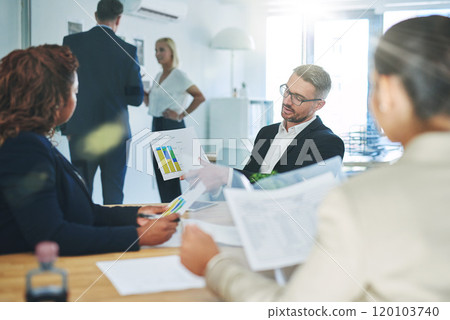 Success is the product of teamwork. Shot of corporate colleagues working together in their office. 120103740