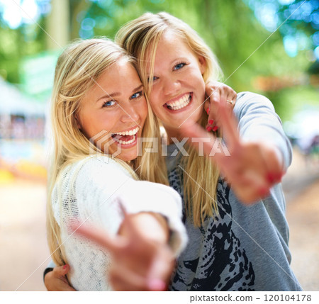 Having fun with my best friend. Two friends having fun at a festival. 120104178