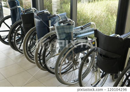 Wheelchairs lined up 120104296