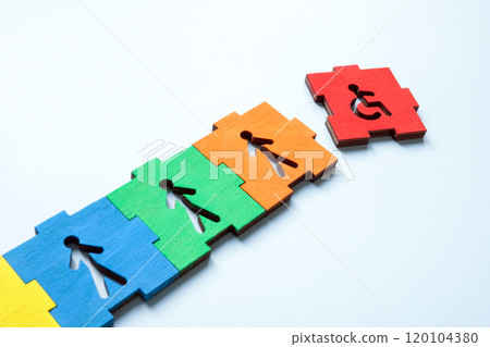 Colorful puzzle with disabled person sign added. Inclusion and accessibility. 120104380