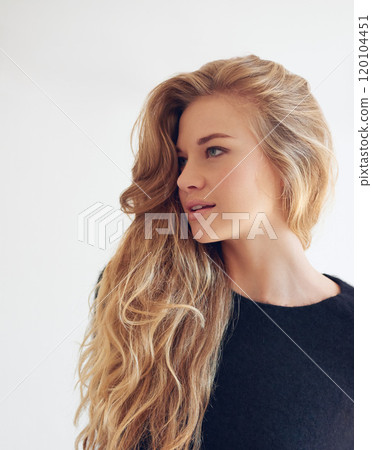 The hair is the richest ornament of a woman. Shot of a beautiful young woman looking thoughtful. The hair is the richest ornament of a woman. Shot of a beautiful young woman looking thoughtful. 120104451