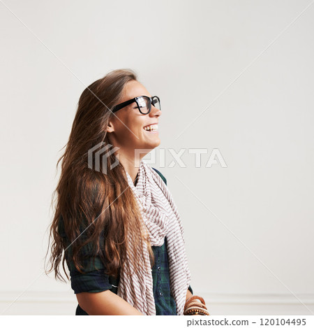 Laughter and relaxation. Shot of a stylish young woman laughing. Laughter and relaxation. Shot of a stylish young woman laughing. 120104495
