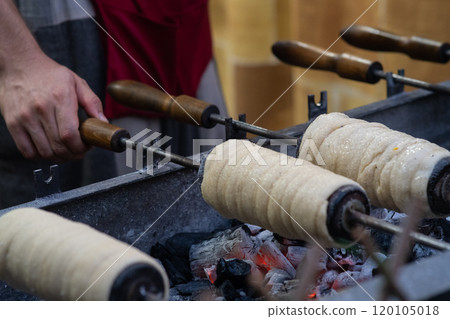 Cooking sweet buns on a spit 120105018