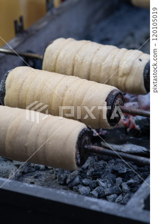 Cooking sweet buns on a spit 120105019