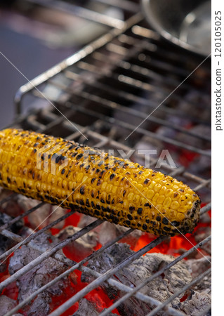 Corn pads on a grill on charcoal Corn pads on a grill on charcoal 120105025