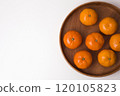 Tangerines on a plate on white background 120105823