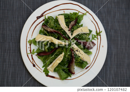 Pear salad with herbs. Pear salad on a white plate. 120107482