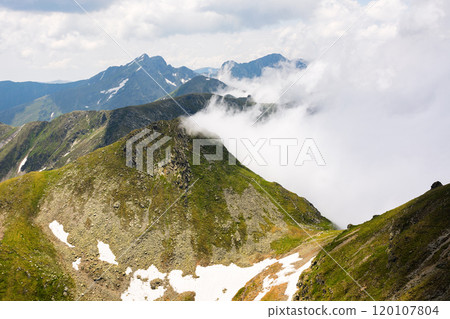 mountain landscape of romania in summer. fagaras ridge in clouds. alpine scenery on a sunny day. popular travel destination of europe. high altitude viewpoint 120107804