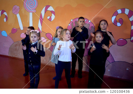 5-7-year-old children warm up at an acting class, extracurricular activities 5-7-year-old children warm up at an acting class, extracurricular activities 120108436