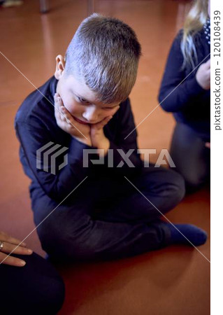 5-7 year old children sit in a circle at an acting class, extracurricular activities 5-7 year old children sit in a circle at an acting class, extracurricular activities 120108439