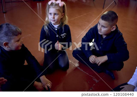 5-7 year old children sit in a circle at an acting class, extracurricular activities 5-7 year old children sit in a circle at an acting class, extracurricular activities 120108440