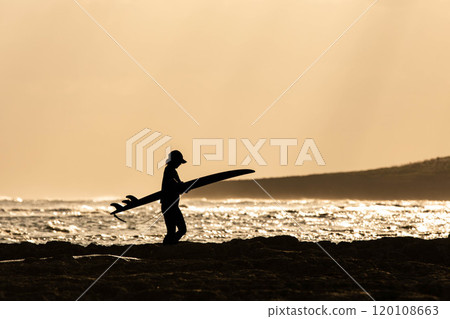 Sunset female surfer silhouette Sunset female surfer silhouette 120108663