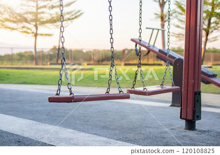 Empty chain swing in the playground Empty chain swing in the playground 120108825