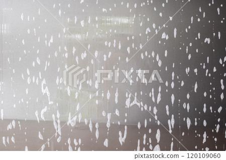car cleaning and washing with foam soap on the gray car background 120109060