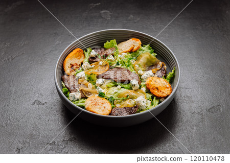 Gourmet salad with blue cheese, pear slices, toasted bread, and greens, perfect fusion of flavors Gourmet salad with blue cheese, pear slices, toasted bread, and greens, perfect fusion of flavors 120110478