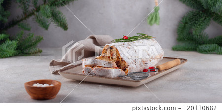 Festive fruitcake slice on rustic plate Festive fruitcake slice on rustic plate 120110682