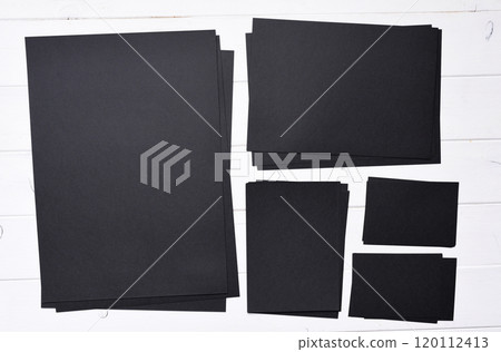 stacks of black paper 120112413