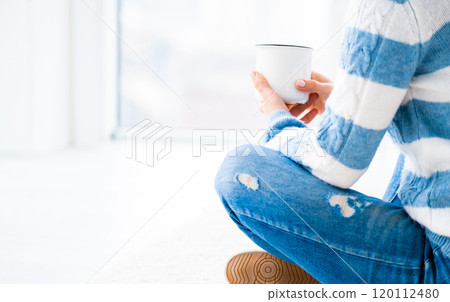 Girl relaxing with cup Girl relaxing with cup 120112480