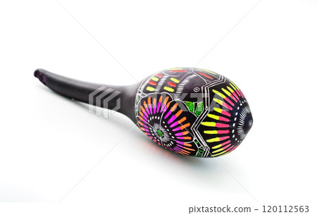 Painted maracas lying on white 120112563