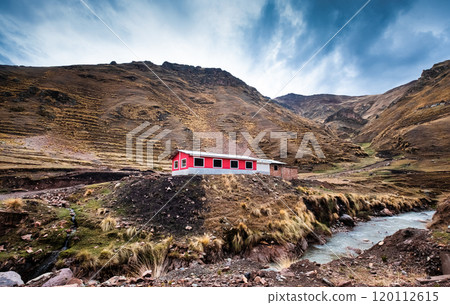 Pink flat house among Peruvian rocky mountains Pink flat house among Peruvian rocky mountains 120112615
