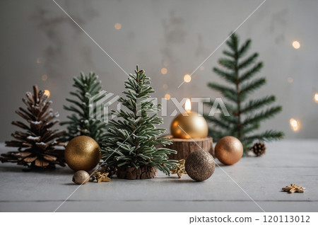 A festive Christmas scene featuring miniature pine trees, gold ornaments, and a lit candle on a wooden slice. Perfect for adding a touch of holiday cheer to your home decor. A festive Christmas scene featuring miniature pine trees, gold ornaments, and a lit candle on a wooden slice. Perfect for adding a touch of holiday cheer to your home decor. 120113012