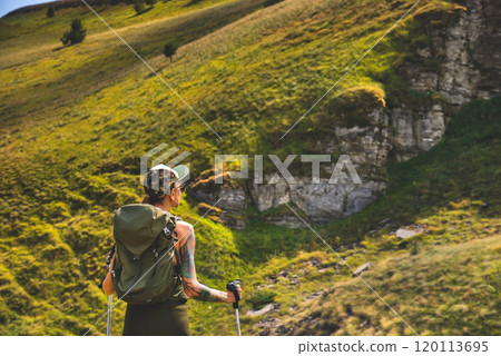 Woman Traveler Hiking Alone in Summer Mountains Woman Traveler Hiking Alone in Summer Mountains 120113695