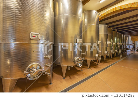 Modern production wine cellar with stainless steel tank, Canale, Piedmont, Italy 120114282