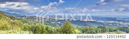 Panoramic view of a traditional Corsican mountain village with the vast eastern coastline in the distance 120114402