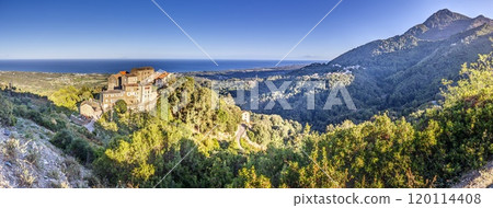 Panoramic view of a traditional Corsican mountain village with the vast eastern coastline in the distance Panoramic view of a traditional Corsican mountain village with the vast eastern coastline in the distance 120114408