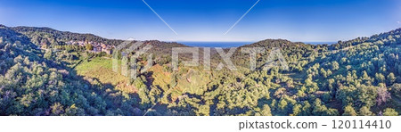 Aerial panorama of a traditional Corsican mountain village with views of the dramatic eastern coastline Aerial panorama of a traditional Corsican mountain village with views of the dramatic eastern coastline 120114410