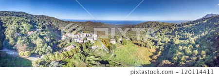 Aerial panorama of a traditional Corsican mountain village with views of the dramatic eastern coastline Aerial panorama of a traditional Corsican mountain village with views of the dramatic eastern coastline 120114411