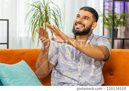 Rich happy man showing wasting or throwing money around hand gesture, big profit win lottery, share 120114520