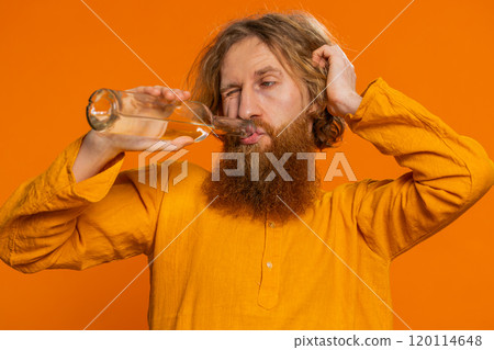 Drunk Caucasian man after party drinks vodka beverage from bottle, celebrating victory win addiction Drunk Caucasian man after party drinks vodka beverage from bottle, celebrating victory win addiction 120114648