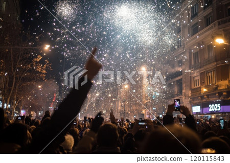 New Years Eve crowd with fireworks 120115843