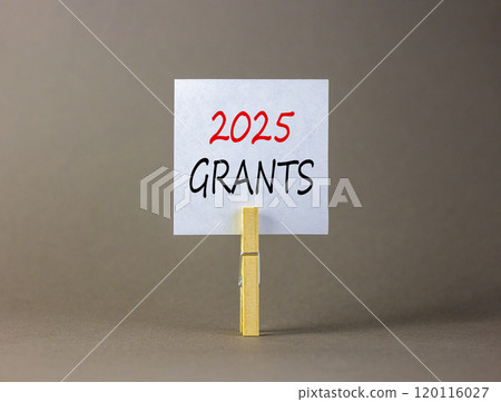 Planning 2025 grants new year symbol. Concept words 2025 Grants on beautiful white paper on wooden clothespin. Beautiful grey background. Business 2025 grants new year concept. Copy space. Planning 2025 grants new year symbol. Concept words 2025 Grants on beautiful white paper on wooden clothespin. Beautiful grey background. Business 2025 grants new year concept. Copy space. 120116027