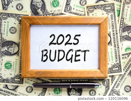 Planning 2025 budget new year symbol. Concept words 2025 Budget on beautiful wooden picture frame. Beautiful background from dollar bills. Black pen. Business 2025 budget new year concept. Copy space. Planning 2025 budget new year symbol. Concept words 2025 Budget on beautiful wooden picture frame. Beautiful background from dollar bills. Black pen. Business 2025 budget new year concept. Copy space. 120116096