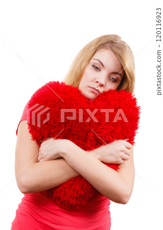 Woman sad girl hugging red heart love symbol Woman sad girl hugging red heart love symbol 120116923