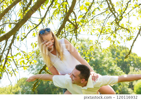 Happy couple having romantic date in park Happy couple having romantic date in park 120116932