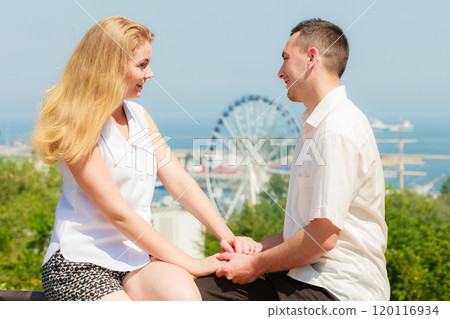 Happy romantic couple with city in background Happy romantic couple with city in background 120116934