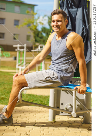 Young man relaxing after outdoor workout Young man relaxing after outdoor workout 120117287
