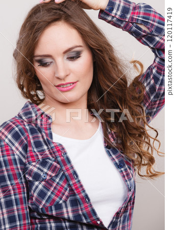 Attractive woman wearing checkered shirt 120117419