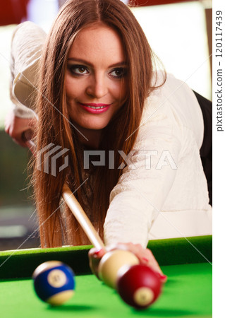Young woman having fun with billiard. Young woman having fun with billiard. 120117439