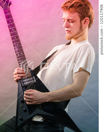 Man playing on electric guitar 120117906