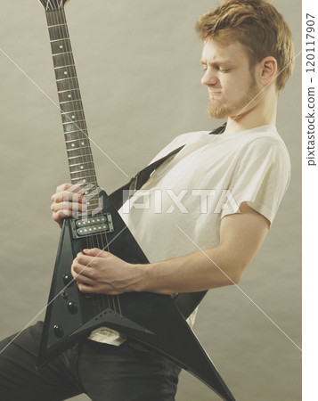 Man playing on electric guitar Man playing on electric guitar 120117907